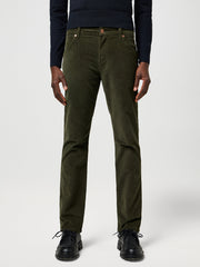 Person wearing olive green pants on a white background