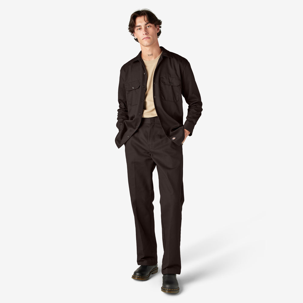 Man wearing a dark brown jacket and pants on a white background