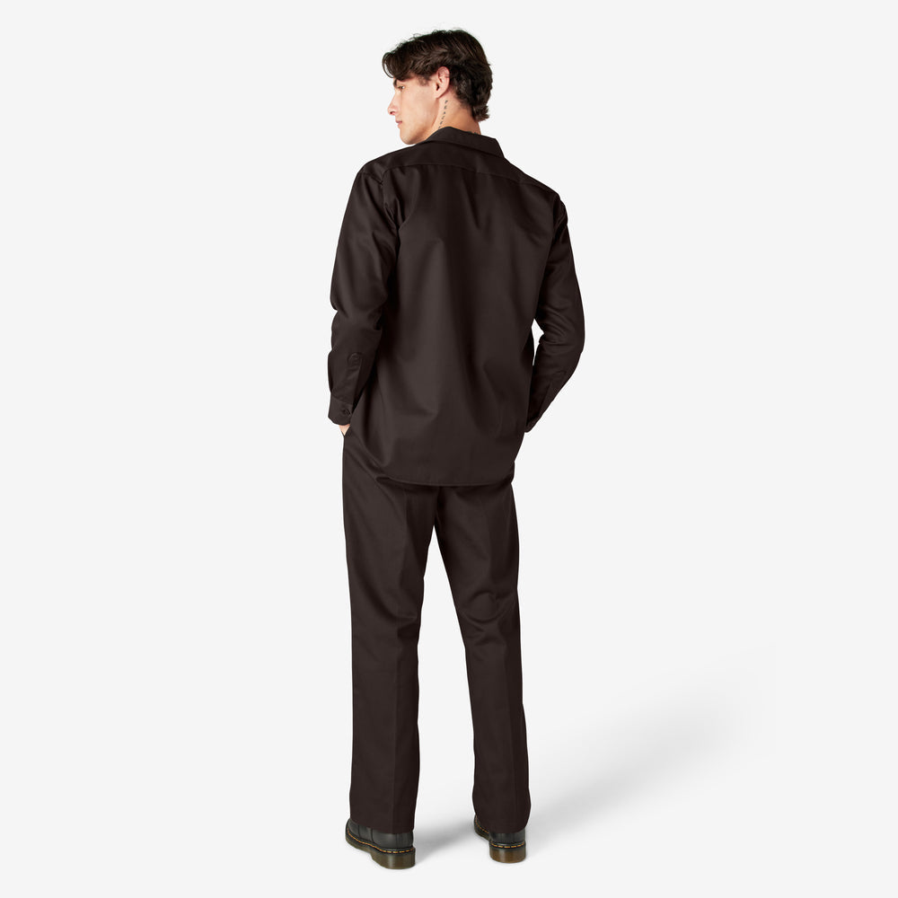 Person wearing a black outfit on a white background