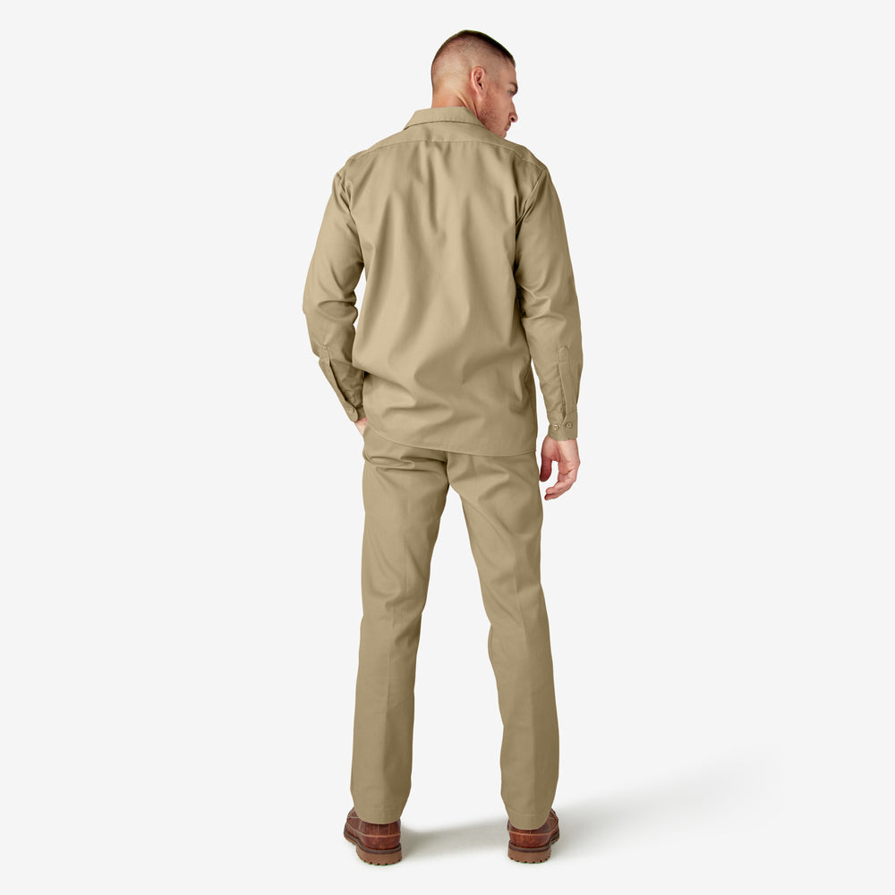 Man wearing a beige jumpsuit on a white background