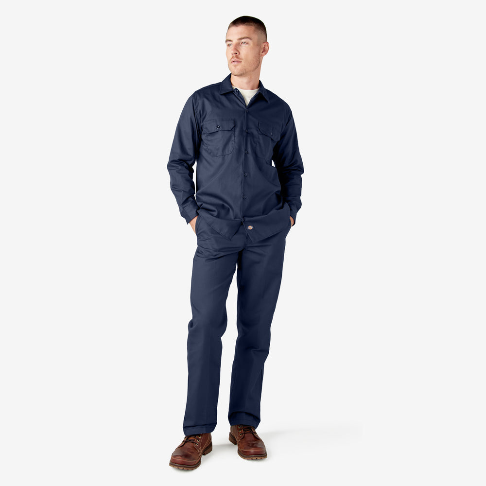 Man wearing a navy blue coverall on a white background