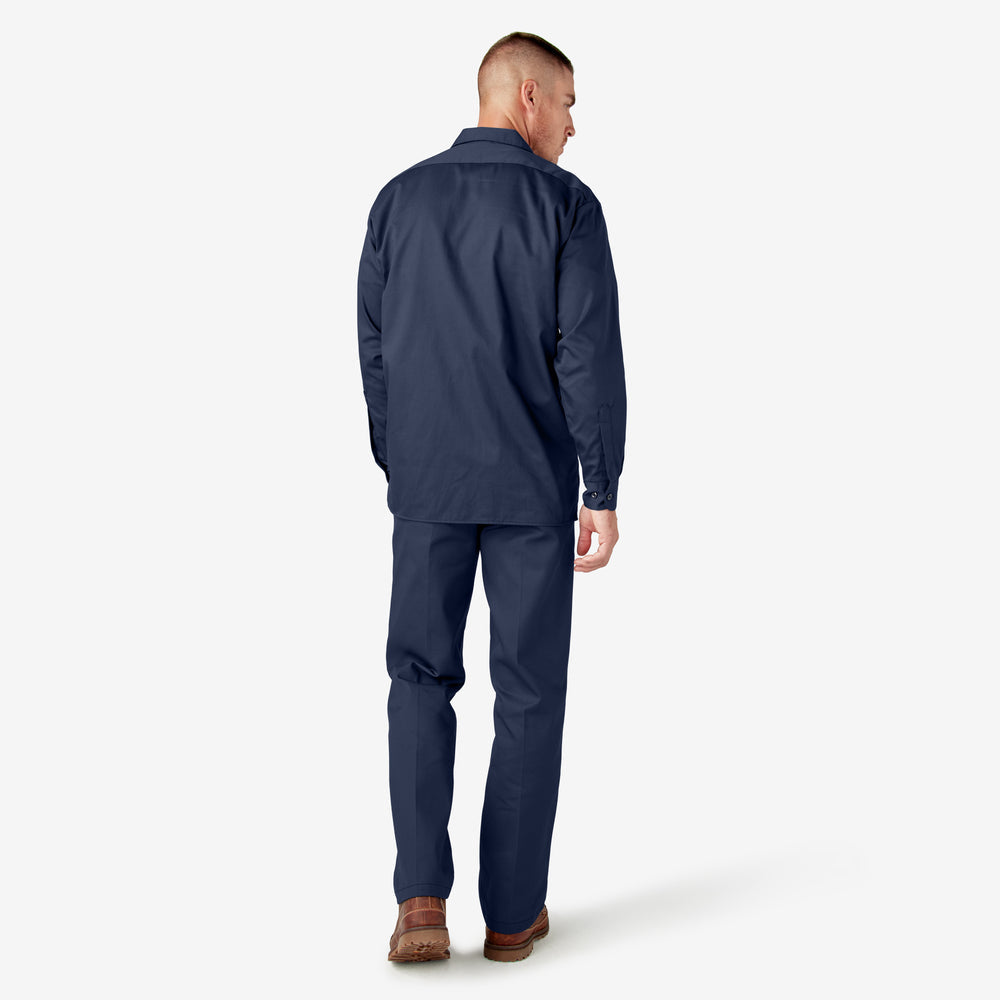 Man wearing a navy blue raincoat and pants on a white background