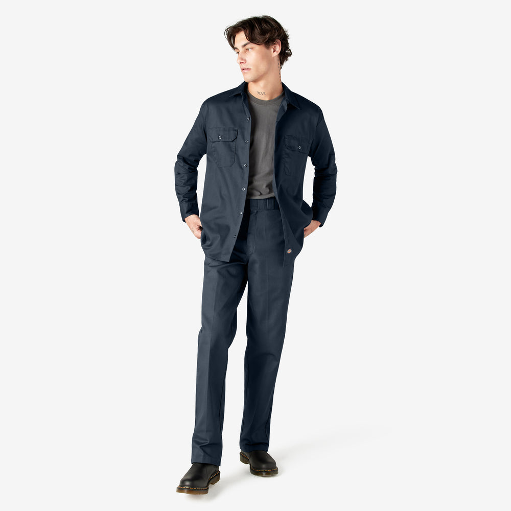 Man wearing a navy jacket and pants on a white background