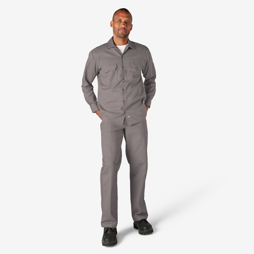 Man wearing a gray work outfit on a white background