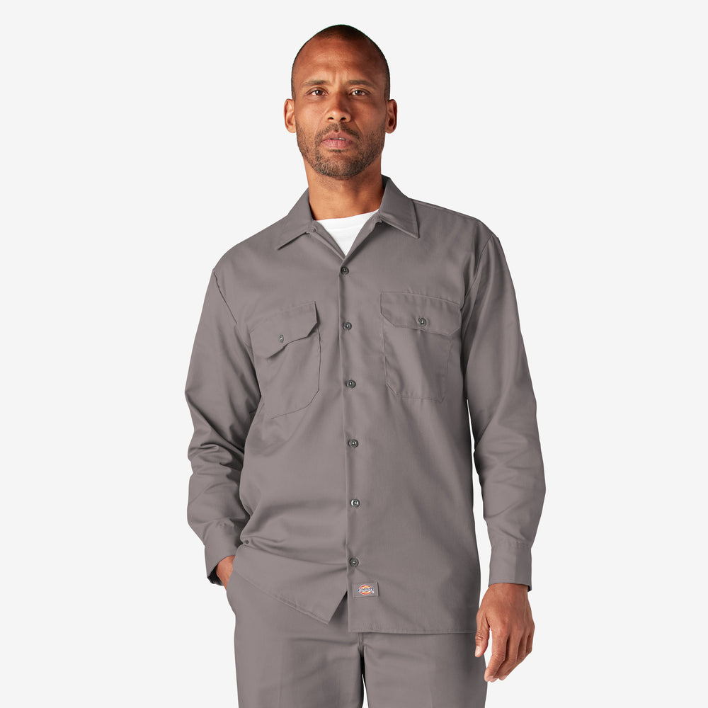 Man wearing a gray work shirt on a white background