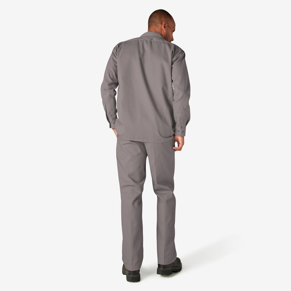 Man wearing a gray jumpsuit on a white background