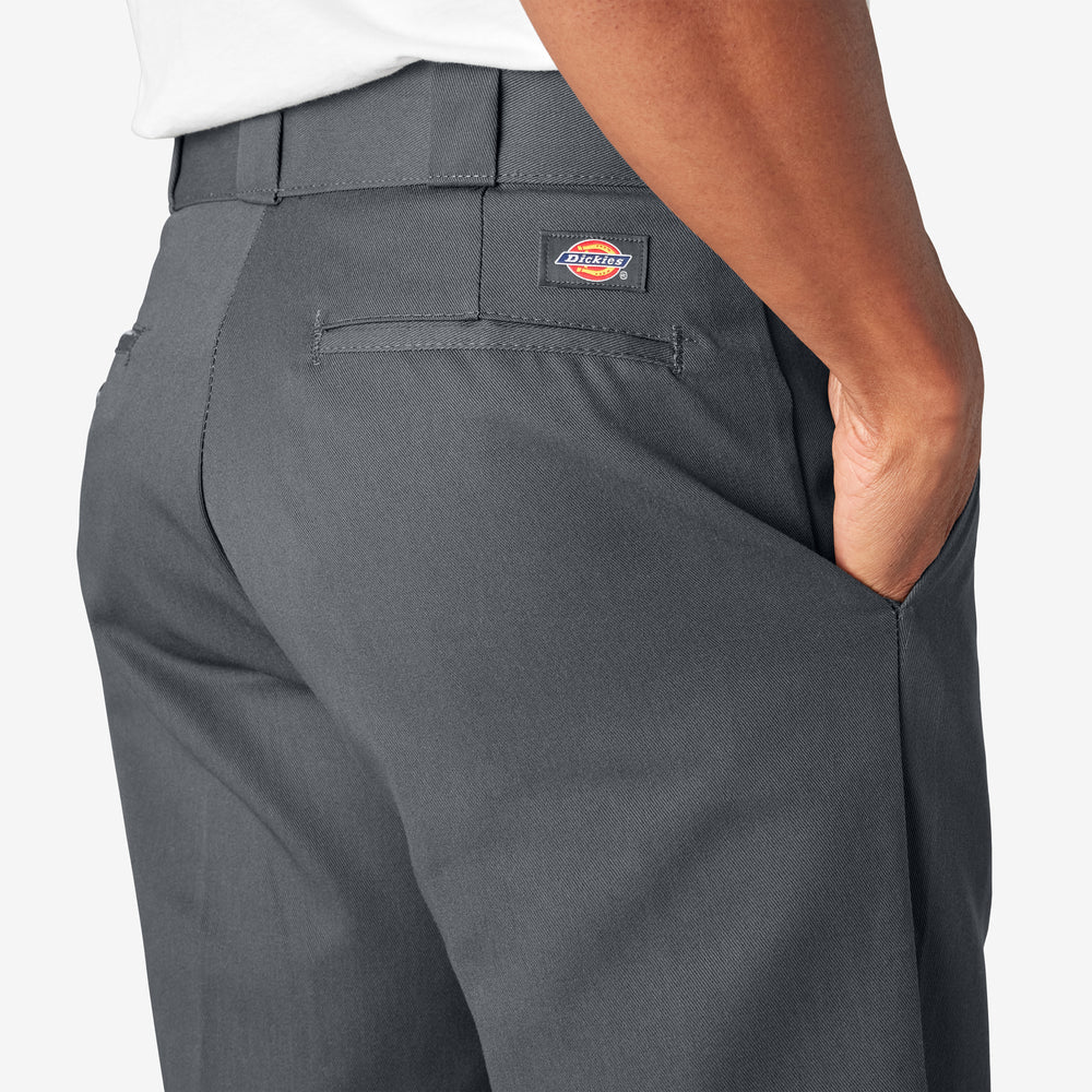 Gray pants with a Dickies logo on the pocket against a white background