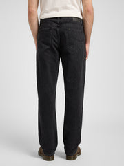 Person wearing black jeans on a white background